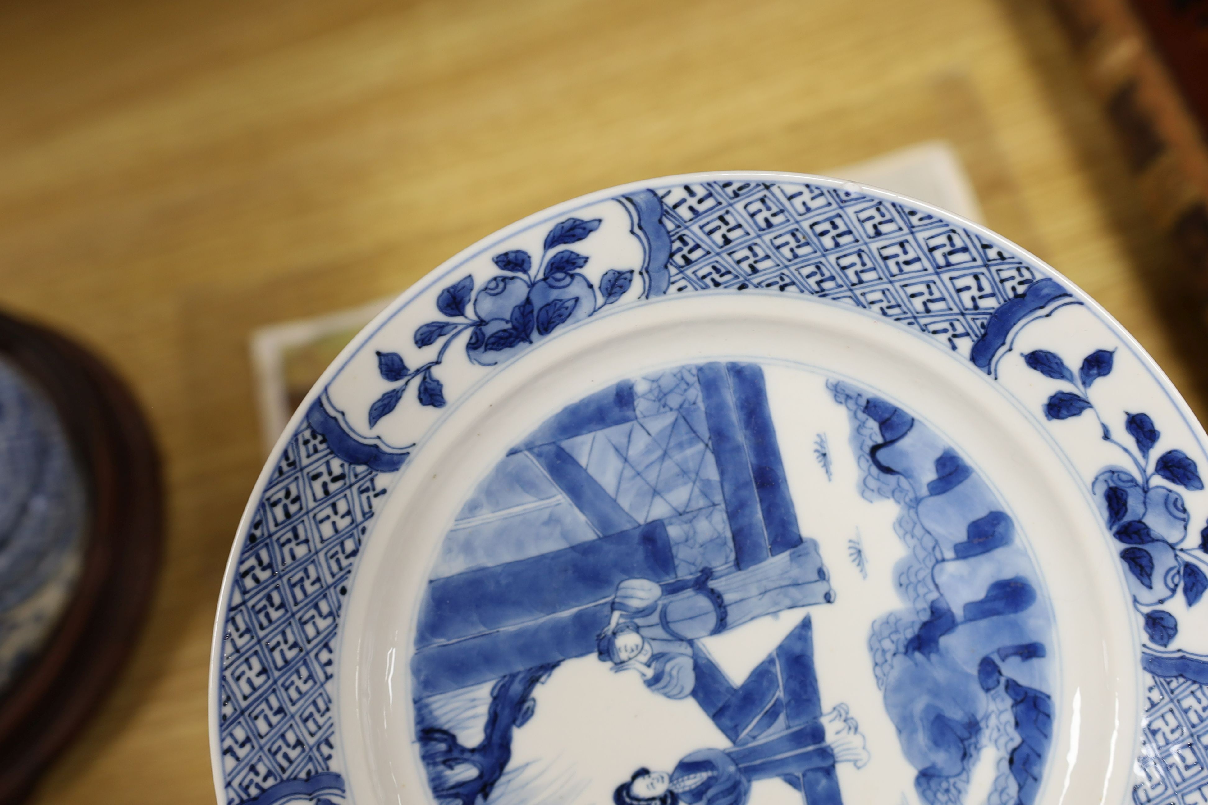 Two Chinese blue and white plates, Kangxi period, one with Kangxi mark the other a Chenghua mark, 21 cms diameter